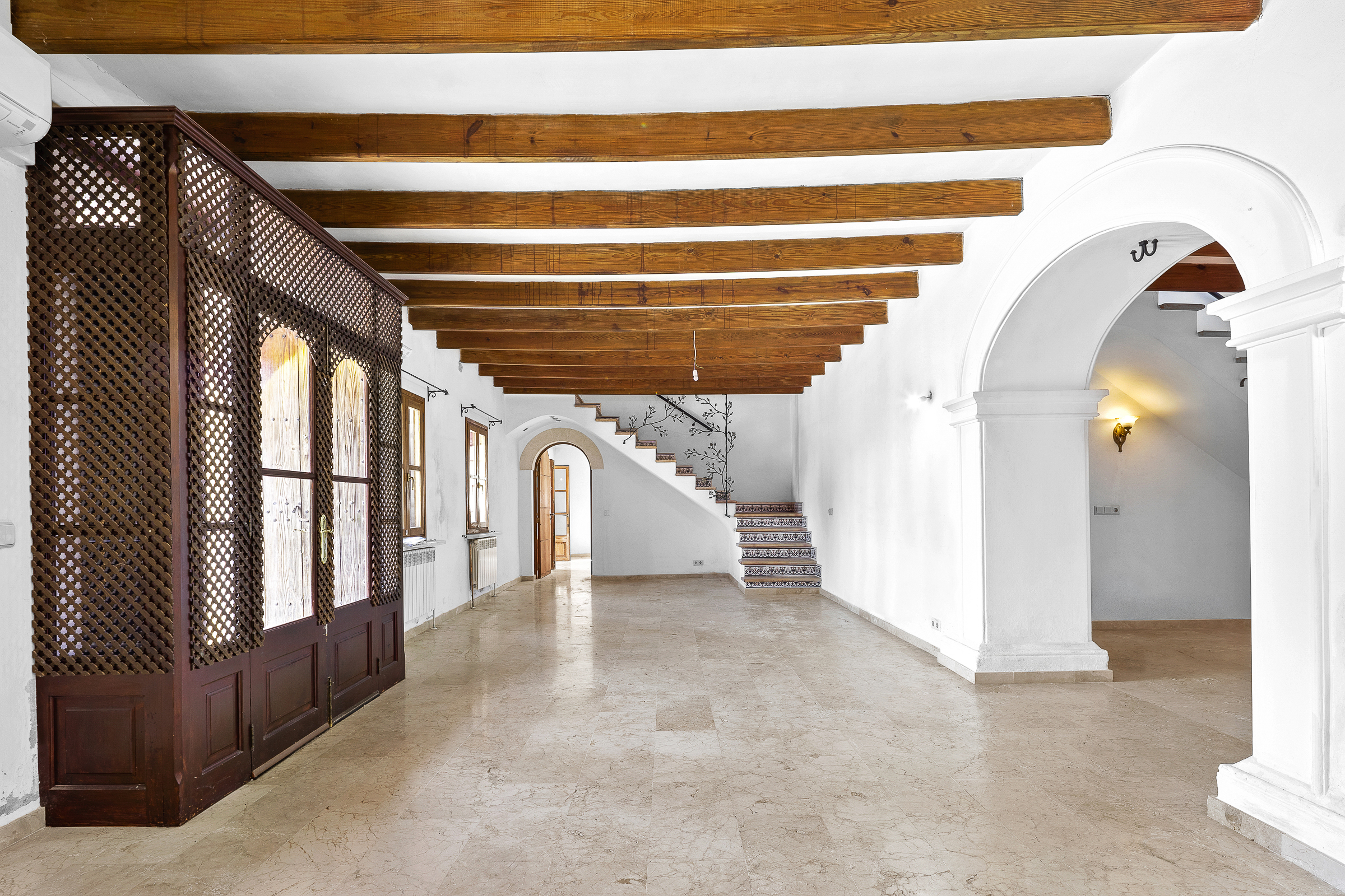 Spacious interior with timber beams